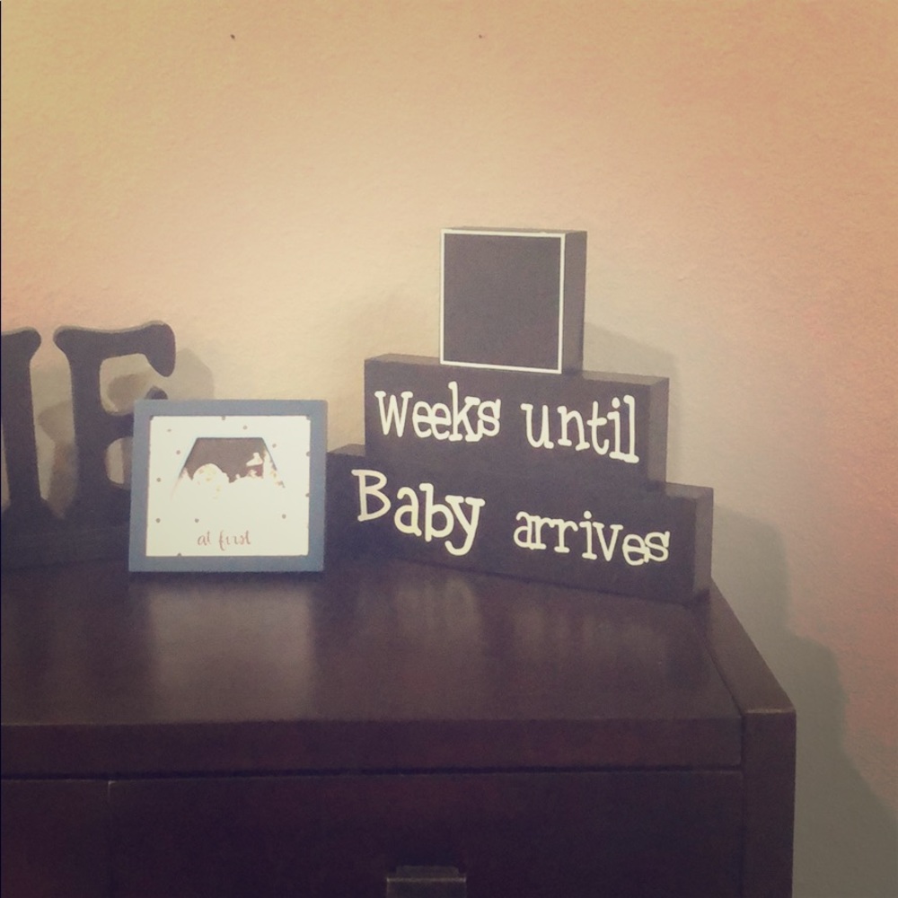 Chalk board “baby arrives” decor